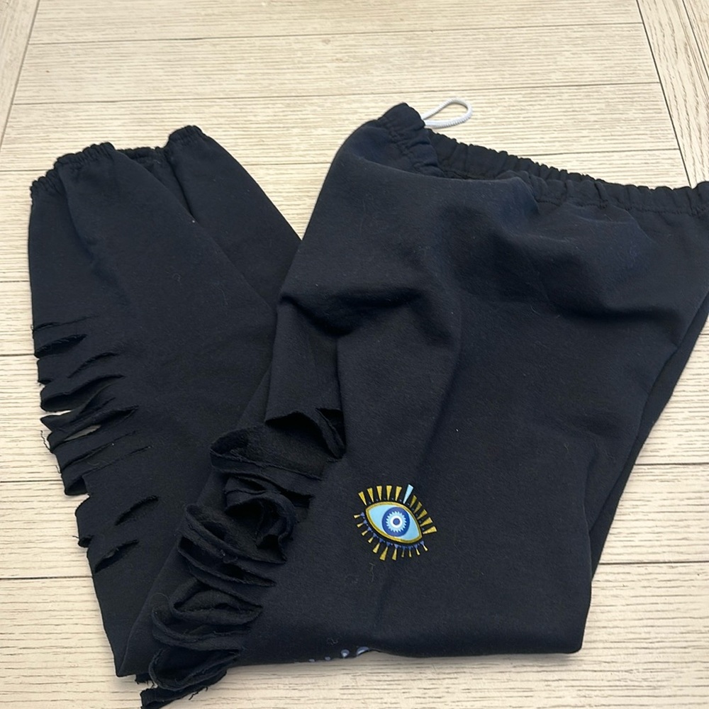 Custom made distressed joggers with evil eye. Size medium